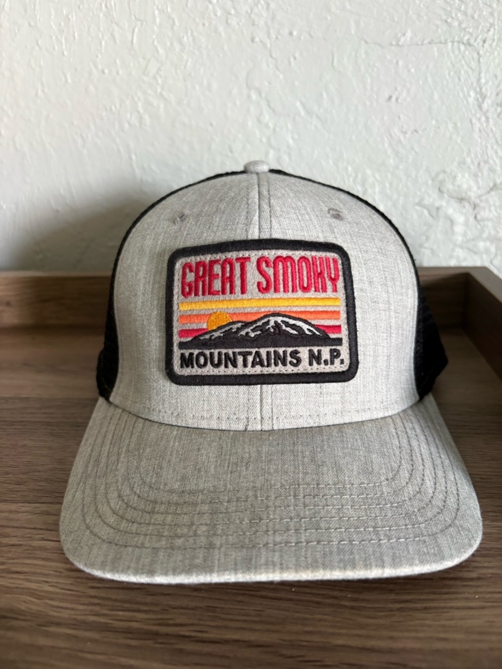 Legacy Black Trucker Hat with Green Label
